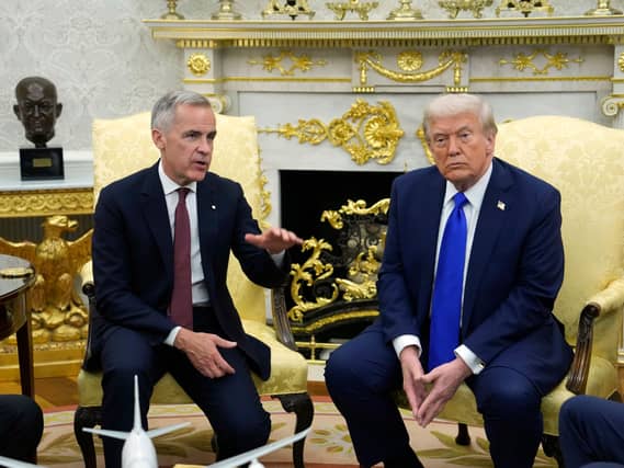 Canadian Prime Minister Mark Carney and US President Donald Trump meet in the White House in 2025