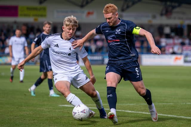 Rio Owen (left) on the ball for AFC Telford United against Hednesford Town
