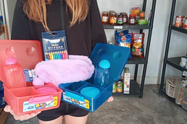 Lottie, 12, who helped the volunteers at Knighton and Presteigne Food Bank to set out the stock for the Back2School essentials project