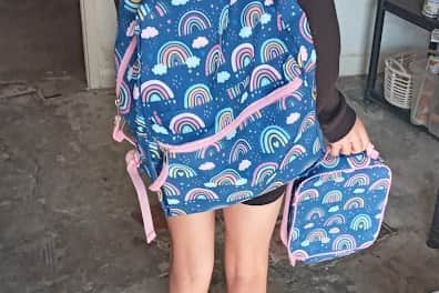 Lottie, 12, modelling one of the backpacks which Knighton and Presteigne Food Bank has purchased for struggling families