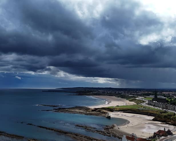 Storm clouds gather over Cullercoats Bay and Tynemouth