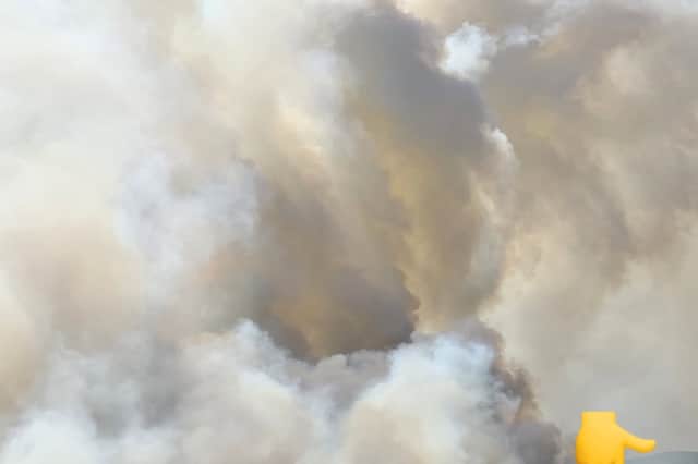 Huge clouds of smoke continue to rise from the Glascwm fire as firefighters and landowners work to contain it.