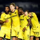 Brentford’s Nathan Collins, second left, celebrates with team-mates, from left, Callum Wilson, Dango Ouattara and Jannik Schuster
