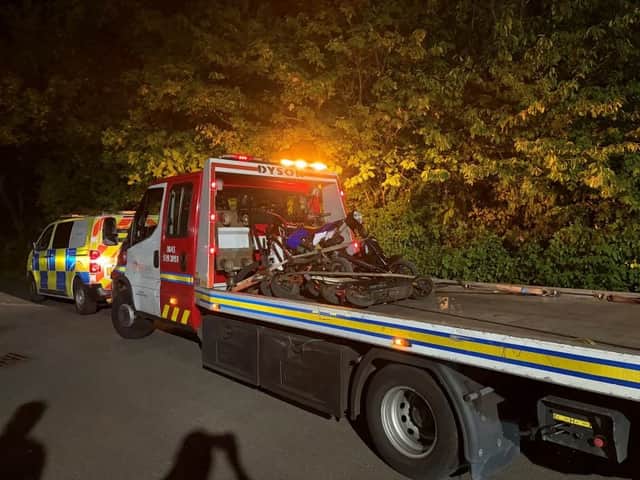 Seized scooters loaded on the back of a truck.
