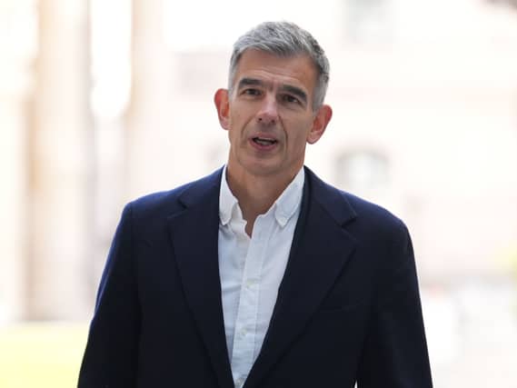 Matt Brittin standing outside, wearing a suit