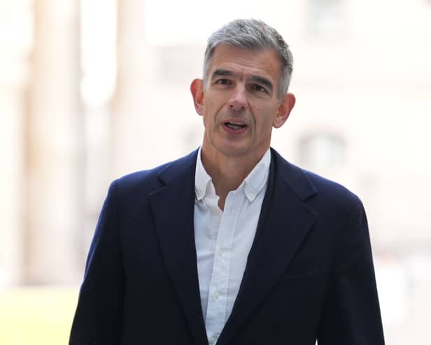 Matt Brittin standing outside, wearing a suit