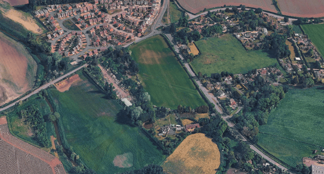 The land, now mostly used for storage, still carries the imprint of its industrial past