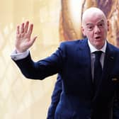 Gianni Infantino waves to photographers