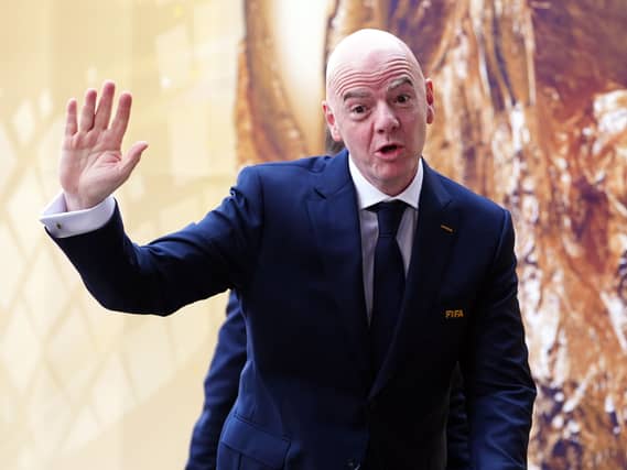 Gianni Infantino waves to photographers
