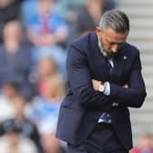 Rangers manager Derek McInnes looks down towards the ground
