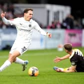 Boreham Wood’s Matt Rush (left) reacts after challenging Burton Albion’s Jack Armer