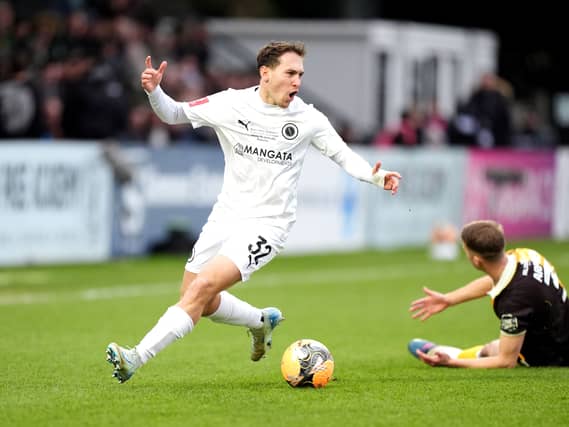 Boreham Wood’s Matt Rush (left) reacts after challenging Burton Albion’s Jack Armer
