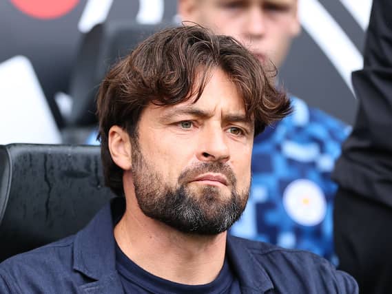 Leicester manager Russell Martin looks on