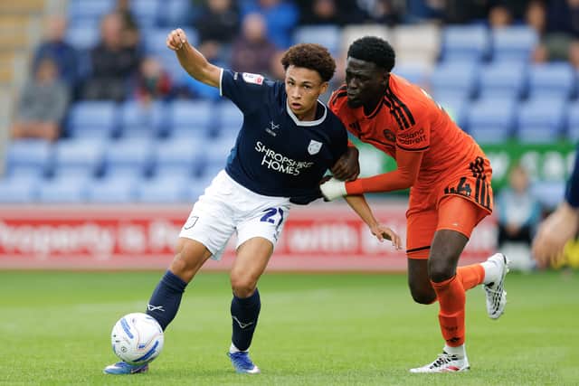 Will Gray of Shrewsbury Town battles with Brendan Sarpong-Wiredu of Salford City
