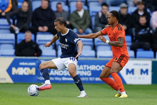 Tom Sang (left) on the ball for Shrewsbury Town against Salford City