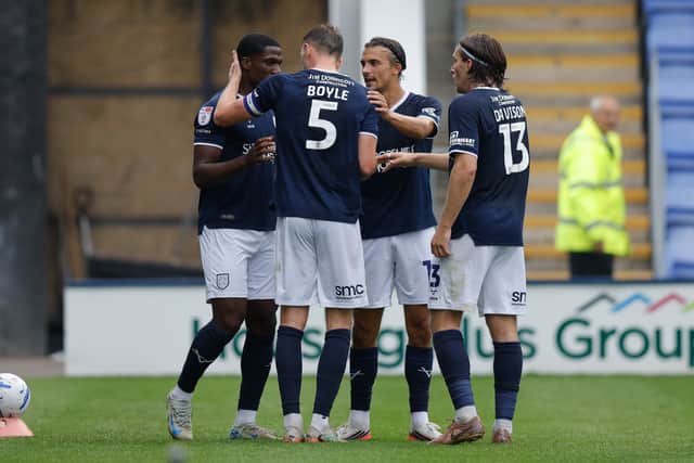 Shrewsbury Town’s players celebrate Will Boyle’s decisive goal