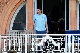 Dan Lawrence looks out from his teams balcony