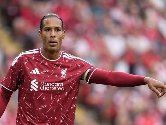 Liverpool captain Virgil van Dijk gestures on the field