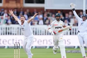 England’s Ollie Robinson, left, successfully appeals for the wicket of Pakistan’s Shan Masood