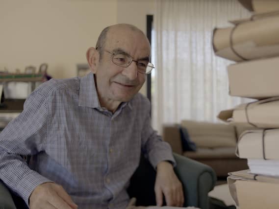 Raja Shehadeh sitting in a chair