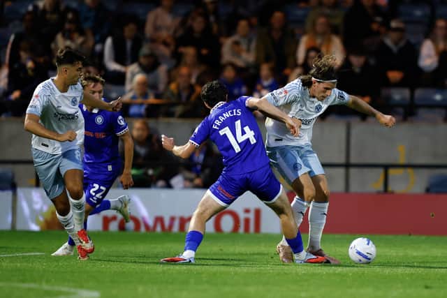 Josh Davison battles with Ed Francis of Rochdale