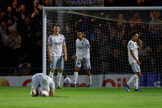 Dejected Shrewsbury Town players during their defeat to Rochdale