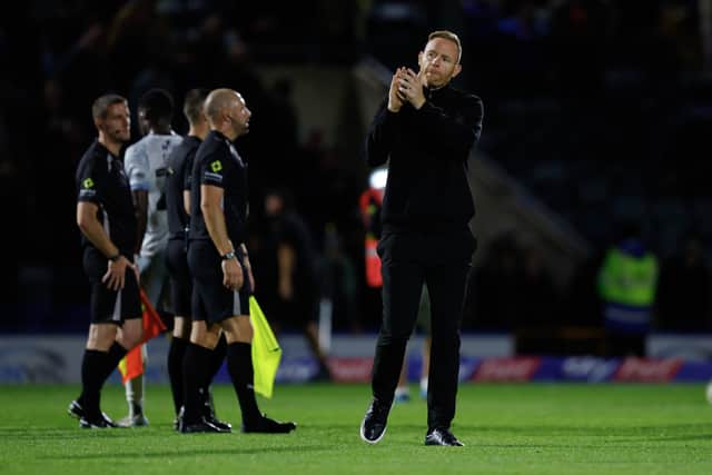Shrewsbury Town boss Gavin Cowan applauds supporters at full-time 