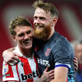 Stoke goalscorer Ethan Galbraith, left, and goalkeeper Viktor Johansson celebrate victory over Norwich