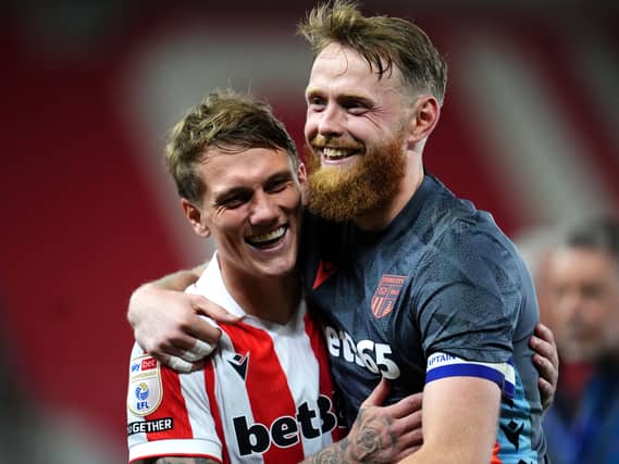 Stoke goalscorer Ethan Galbraith, left, and goalkeeper Viktor Johansson celebrate victory over Norwich