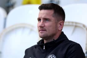 Crewe boss Lee Bell watches from the touchline