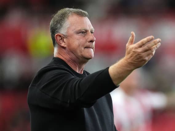 Stoke boss Mark Robins gives instructions from the touchline