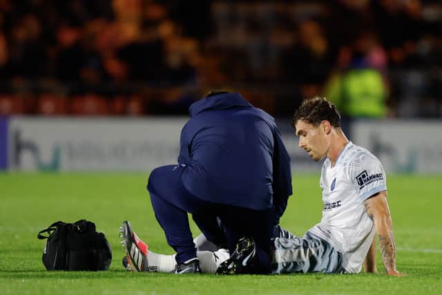 Josh Ruffels receives treatment at Rochdale 