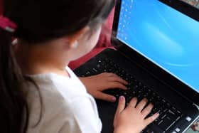 A child using a laptop computer