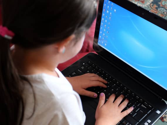 A child using a laptop computer