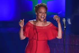 Cassandra Wilson singing in a red dress