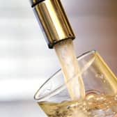 Water pouring into a tap