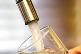 Water pouring into a tap