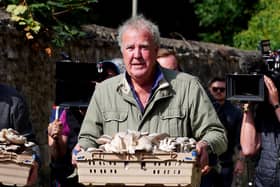 Jeremy Clarkson carrying mushrooms at the opening of his new pub, The Farmer’s Dog, in Asthall, near Burford in Oxfordshire