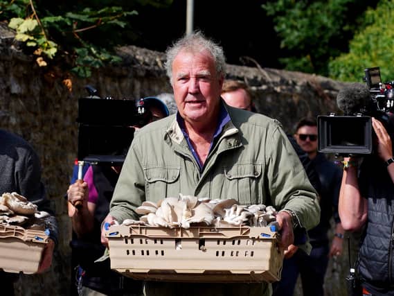 Jeremy Clarkson carrying mushrooms at the opening of his new pub, The Farmer’s Dog, in Asthall, near Burford in Oxfordshire