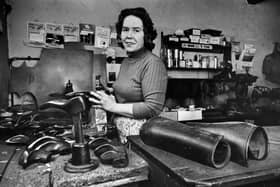 Dorothy Croxton was a cobbler in the village of Penkridge, Staffordshire, and is pictured here at her workshop in May 1970. She took over the job when her husband left the business to work for the council. This image comes from the national archives of the Press Association.  