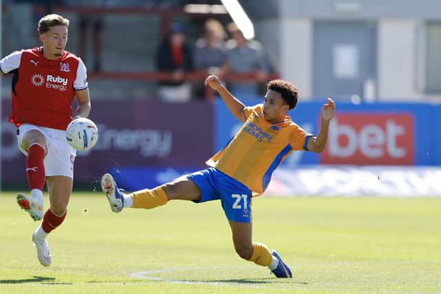 Will Gray challenges Fleetwood Town’s Will Davies 