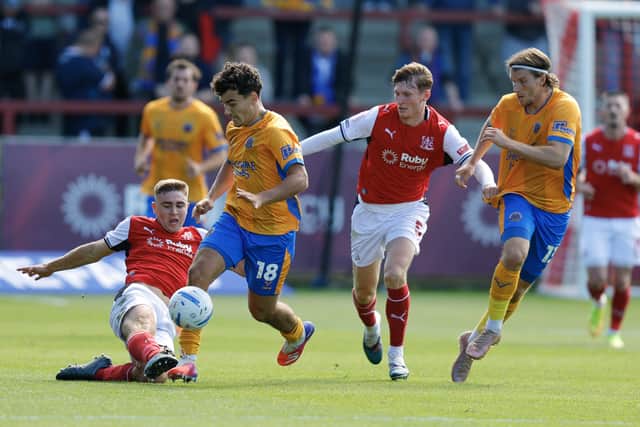 Kian McMahon-Brown tries to break through for Shrewsbury Town against Fleetwood Town