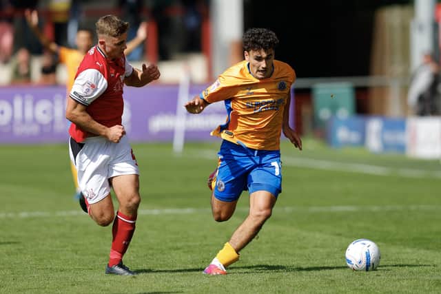 Kian McMahon-Brown drives forward for Shrewsbury Town 