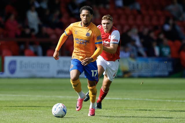 Arkell Jude-Boyd brings the ball forward for Shrewsbury Town at Fleetwood Town