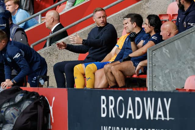Shrewsbury Town boss Gavin Cowan in the dugout at Fleetwood Town