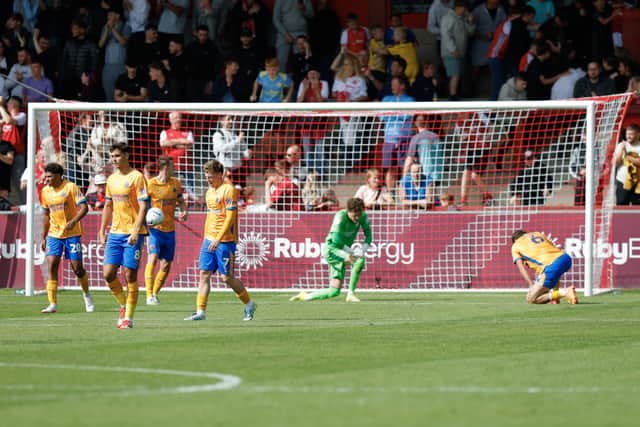 Dejected Shrewsbury Town players after they concede a second goal