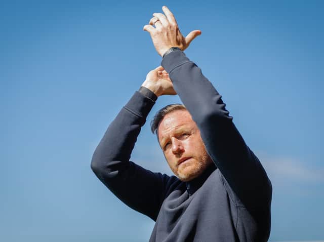 Shrewsbury Town boss Gavin Cowan applauds supporters