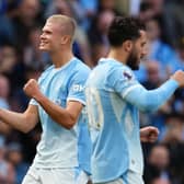 Erling Haaland, left, celebrates