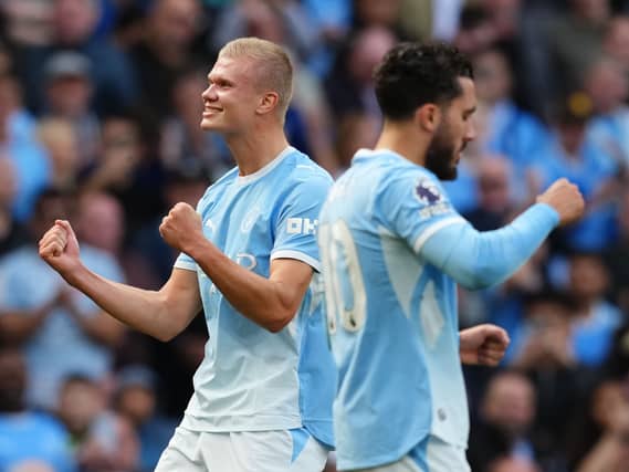 Erling Haaland, left, celebrates