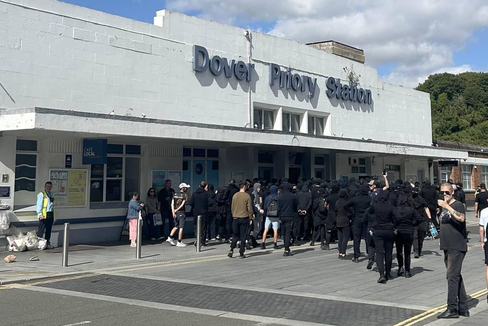Protesters at Dover Priory train station after black-clad and masked anti-illegal migrant demonstrators blocked roads in the port